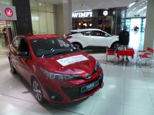 CMH-Toyota-Alberton-display-of-the-New-Yaris-with-sales-exec-in-background